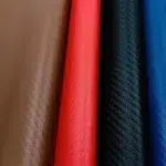 Carbon fiber vinyl upholstery texture from Parma Mer collection in multiple colors with diagonal weave emboss and soft-touch faux leather surface