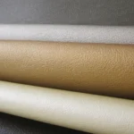 Pearlescent fine pebble grain vinyl from the Lorella collection shown in neutral, champagne gold, silver gray, and dark graphite colorways