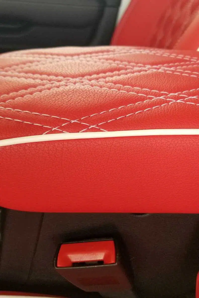 Red Botany Mer faux leather upholstery with diamond stitching and piping used on automotive seat interior