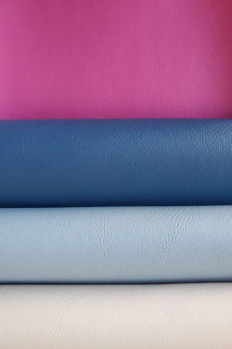 Fine leather grain vinyl texture from the Prima collection featuring Rosé Intense and multiple colors with smooth soft-touch surface and uniform micro-grain finish
