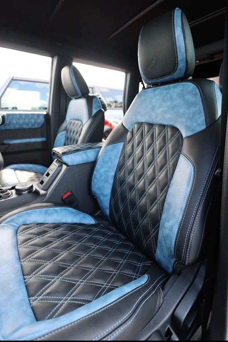 Twilight Blue distressed flat grain two-tone automotive upholstery in custom Bronco seat Softqore