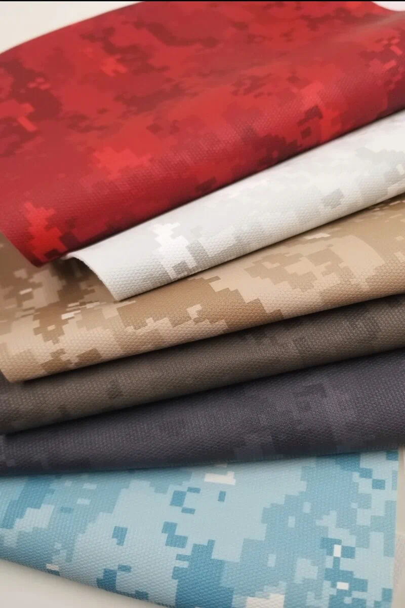Multi-color camo faux leather with embossed digital pixel-grain texture for upholstery.
