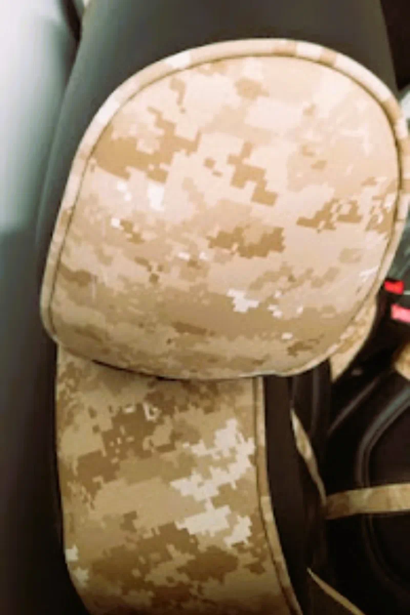 Detail of desert digital camo faux leather used on a custom vehicle headrest and seat bolster.