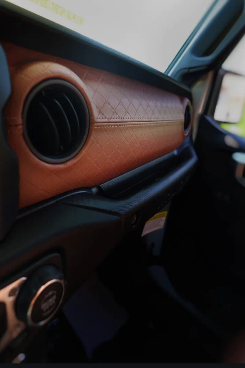 Diamond quilted embossed upholstery installed on a custom automotive dashboard in Morocco brown by Joya Mer