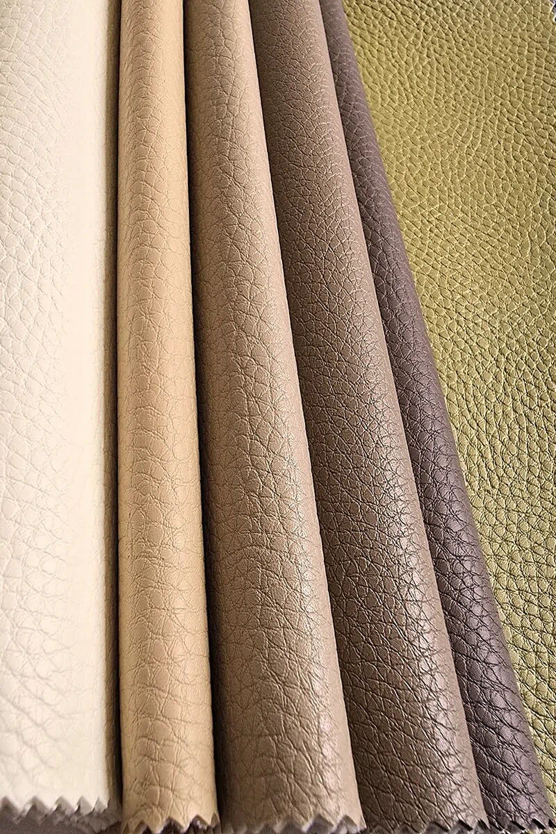 Large pebble grain vinyl and faux leather upholstery texture with a refined leather-like surface.