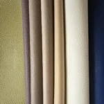 Large pebble grain vinyl and faux leather upholstery texture shown in the Montero Mer color collection.
