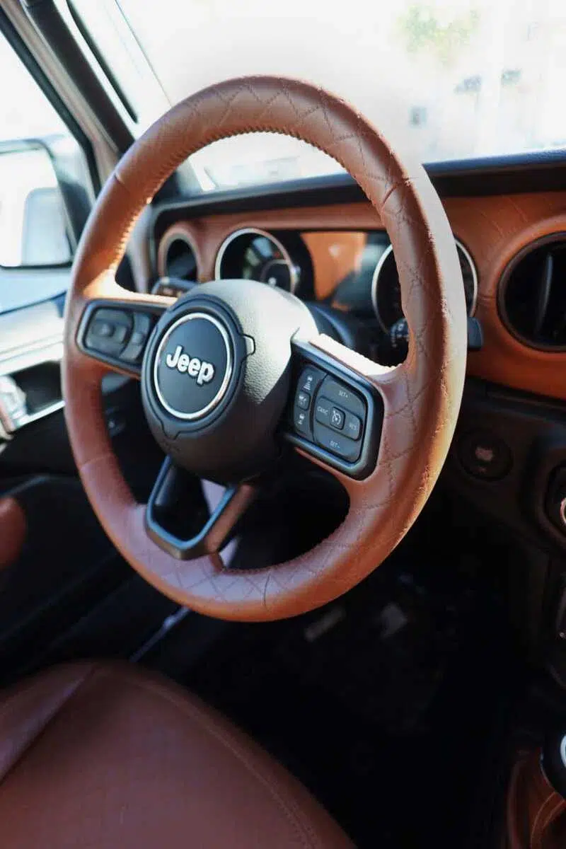 Morocco brown diamond quilted steering wheel upholstery installed on a custom Jeep interior using Joya Mer