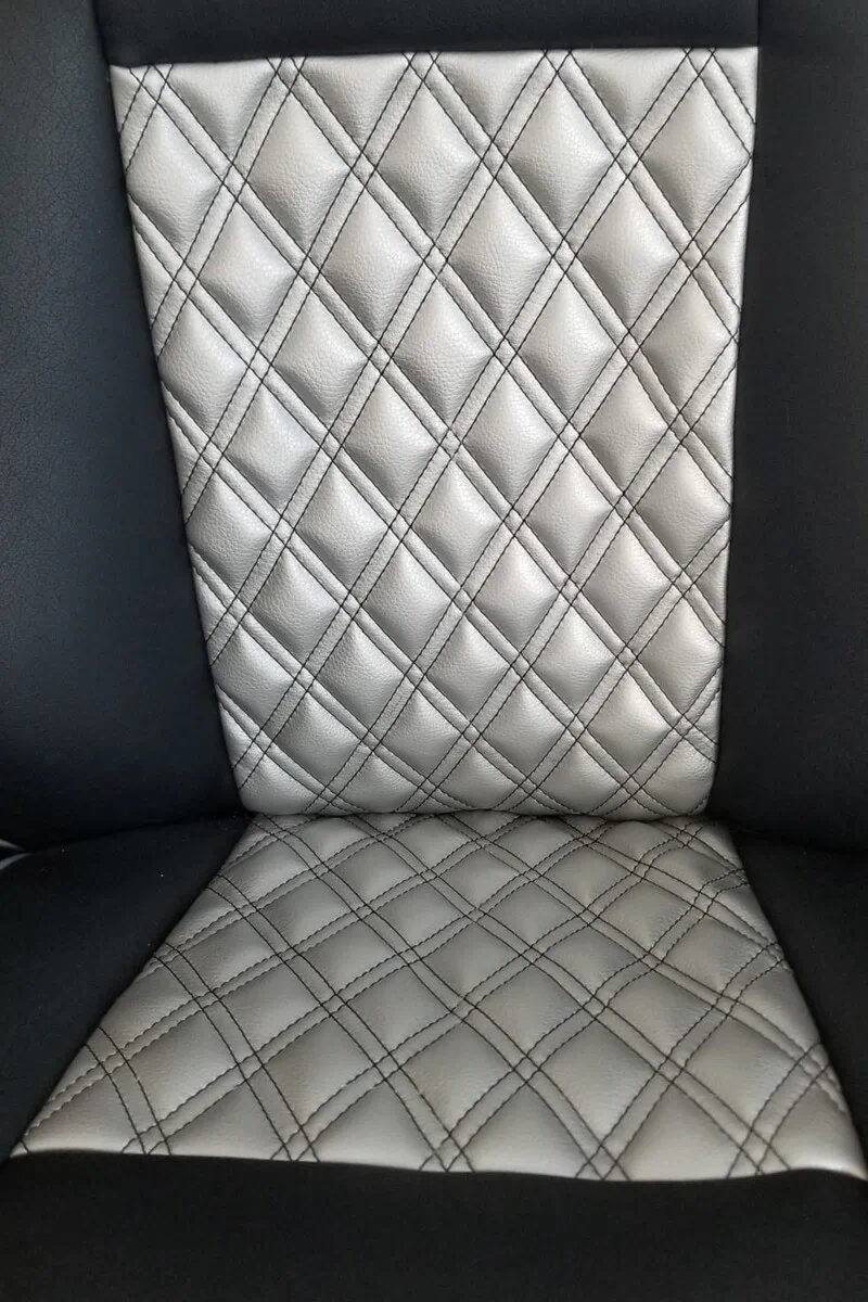 Pearlized pebbled leather texture in Silver Pearl on upholstered seat from Montello Mer with luminous shimmer