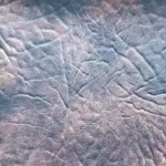 Black Saddle Brown King Ranch marine vinyl fabric sample highlighting the premium two-tone rich boat leather texture.