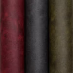 Close-up swatch of Nautic distressed leather texture upholstery fabric showing soft matte creasing and subtle tonal variations